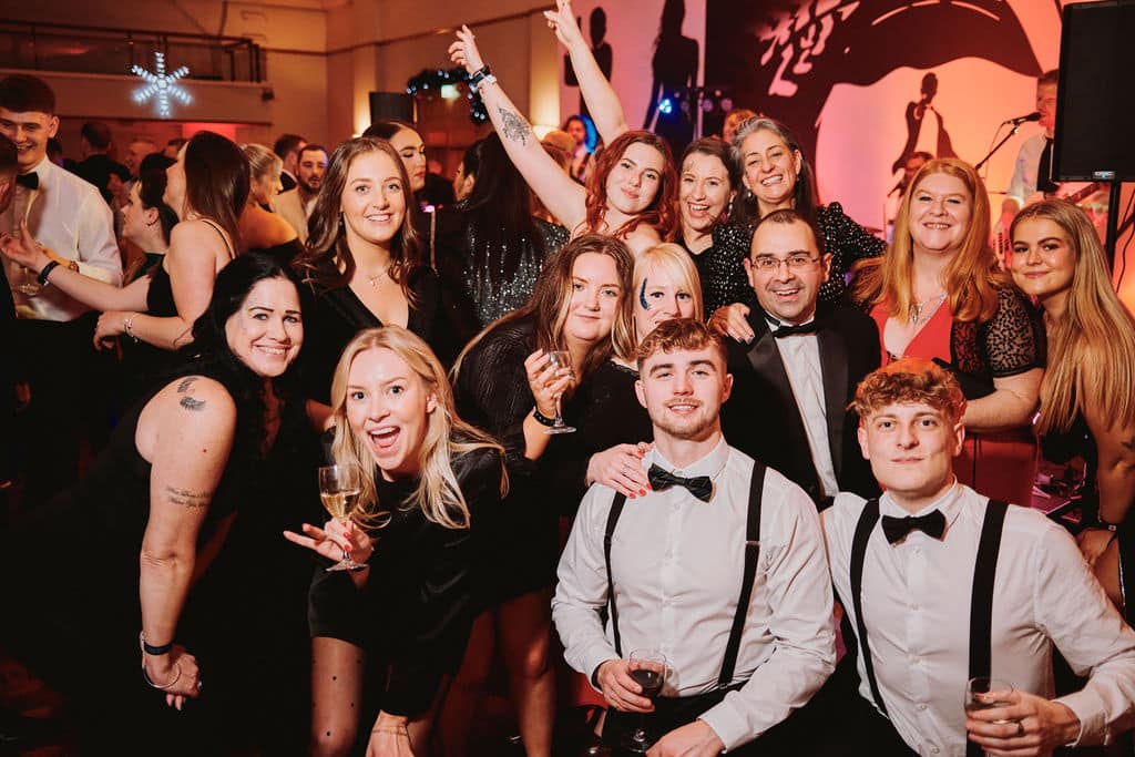 Office Christmas party guests celebrating together with DJ entertainment in Melbourne